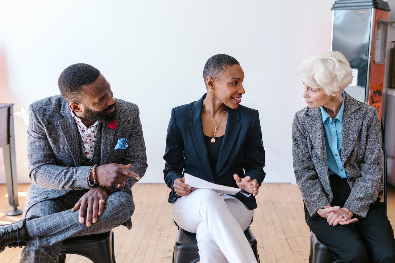 3 People Discussing with Each Other