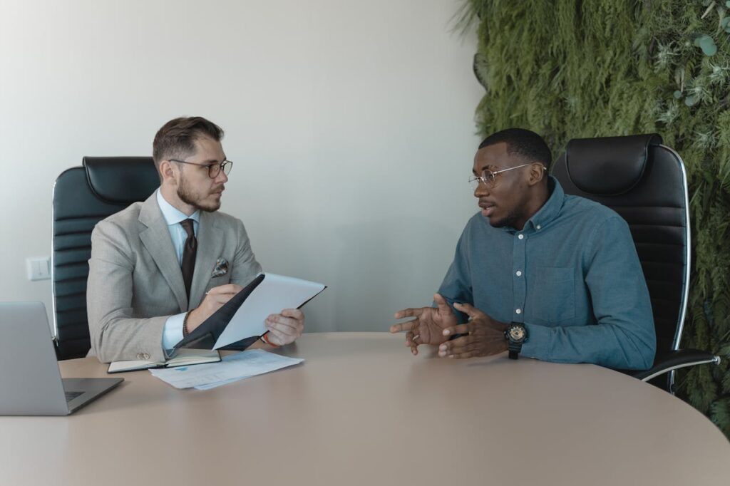 Photo of Two Men Having a Meeting