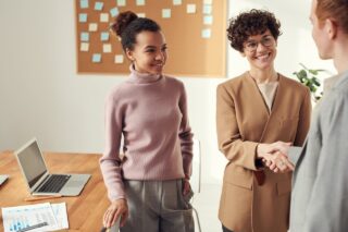 Photo of Co-workers Shaking Hands