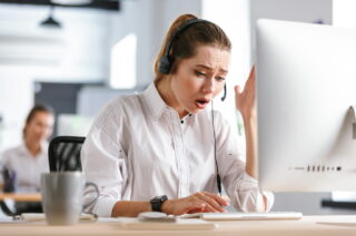 Call Center Agent Woman Visibly Upset Talking With A Customer