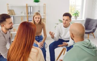 A few students sitting in a circle for conflict coaching